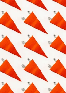 Photo of many red flags, representing the importance of incorporating early warning signs in your burnout prevention plan