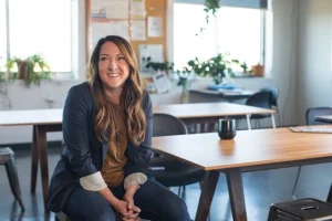 Woman happy after finding solutions for too many meetings